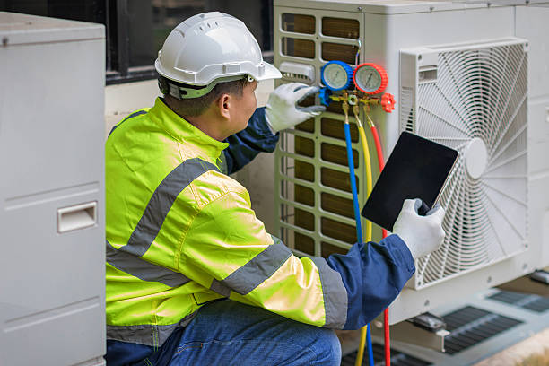 Professional Air Conditioning Repair technician working in Huston, ID